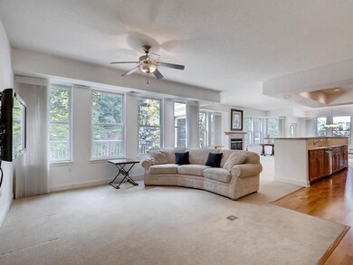 Roomy family room with wall of windows and view to