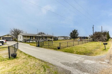 View of street with driveway and a gated entry