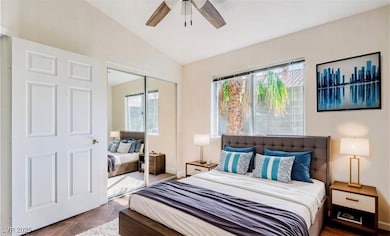 Bedroom with a closet, vaulted ceiling, and ceilin