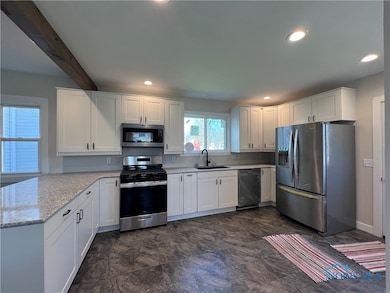 Brand new kitchen with eat-at bar, new appliances,