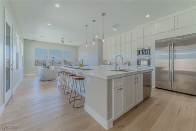 Kitchen featuring open floor plan, light wood-styl