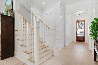 Stairs to second floor off foyer