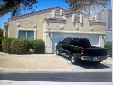 View of front of property featuring driveway and a