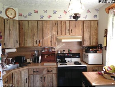 This sunny kitchen offers lots of cabinet space as
