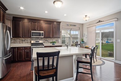 Upgraded kitchen with Corian countertops, slide ou