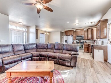Living room with light wood-type flooring, ceiling