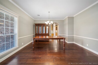 Formal dining room with chair rail trim and crown