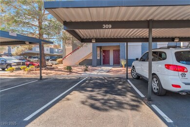View of parking featuring a carport