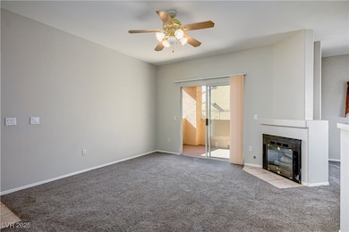 Unfurnished living room featuring carpet floors, a