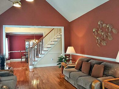 Living Room. Cathedral Ceilings and detailed moldi