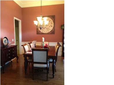Formal dining room off of foyer.