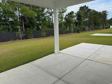 View of yard featuring a patio area and fence