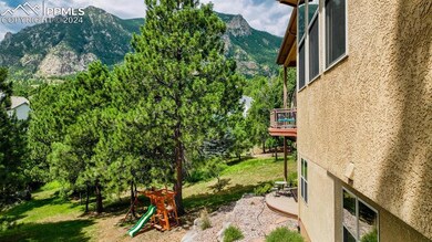 View of yard with a playground and a mountain view