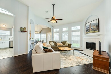 Cozy family room with gas fireplace, open to the kitchen. Lots of natural light!