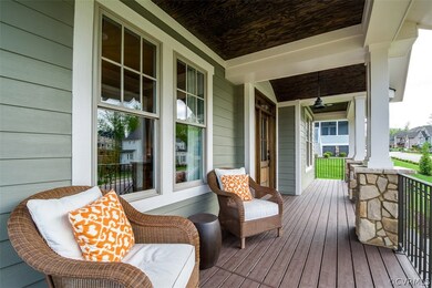 Lovely Front Country Porch with low maintenance Tr