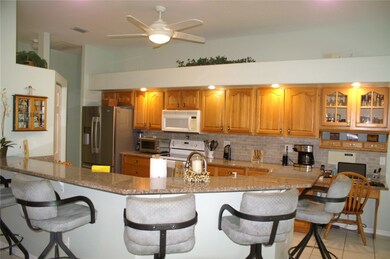 Kitchen with granite countertops and large breakfa