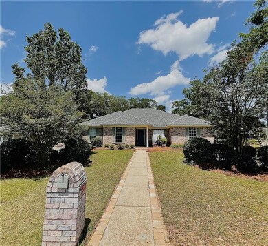 Ranch-style home featuring brick siding, roof with