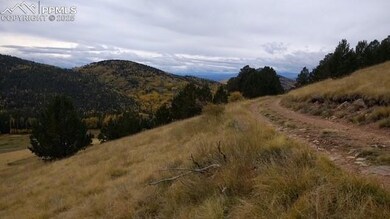 View of mountain background featuring rural landsc