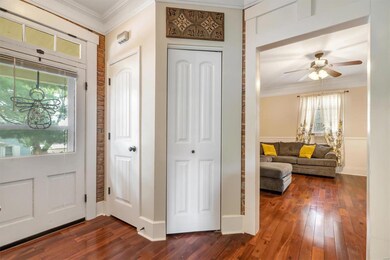 Beautiful wood floors throughout entrance and livi