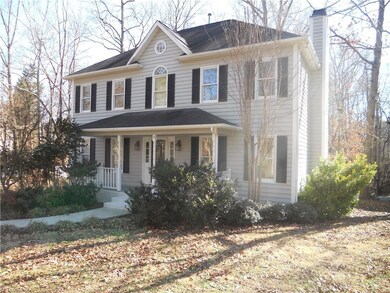 Nicely landscaped with covered front porch on dead end street.