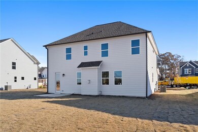 Rear view of house featuring cooling unit