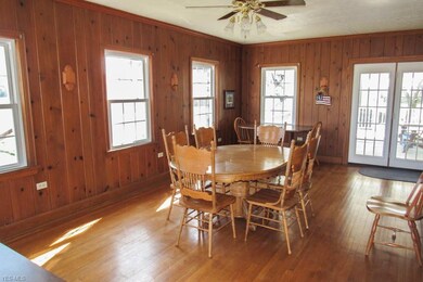 Enormous dining room with wood flooring.