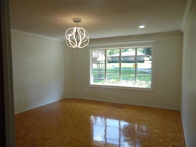 Spare room with an inviting chandelier, parquet fl