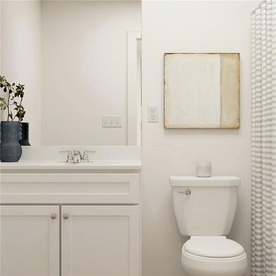 Bathroom featuring vanity and toilet
