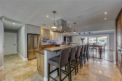 Oversized breakfast bar in updated kitchen faeture
