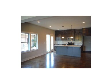 Hardwood floors stretch throughout the dining and 