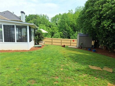 View of yard featuring fence, an outdoor structure