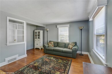 Cozy Living Room with beautiful original wood floo
