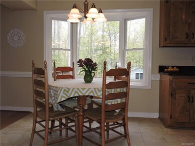 Eat-in kitchen has porcelain tile floor.
