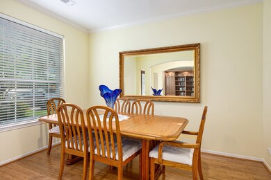 Formal dining room with bamboo flooring and crown