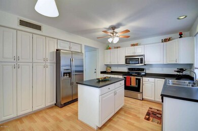 Kitchen has Island & lots of Cabinets