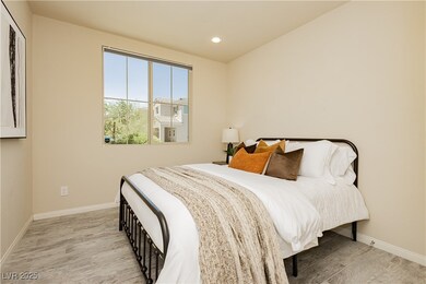 Bedroom downstairs with wood finished floors and r