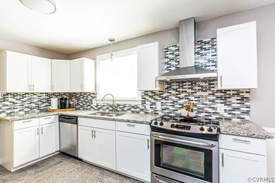 Kitchen featuring wall chimney exhaust hood, taste
