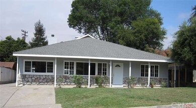 Front of home.  Driveway to the detached garage is