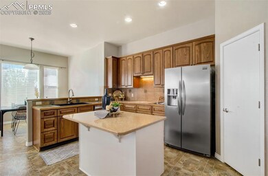 Kitchen with light countertops, stainless steel fr