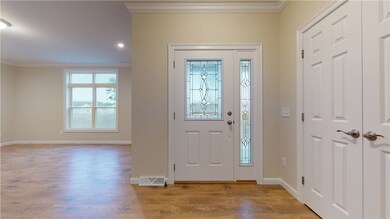 Front entry foyer opens to large den.