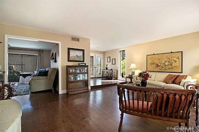 Double entry front doors open to family room.  Den