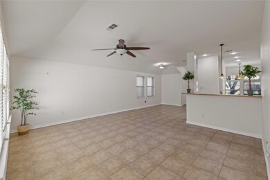 Spare room with ceiling fan, light tile patterned 