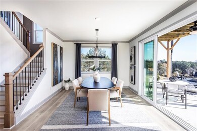 Dining room with stairs, baseboards, and crown mol