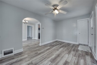 Living room with entrance to dining room.
