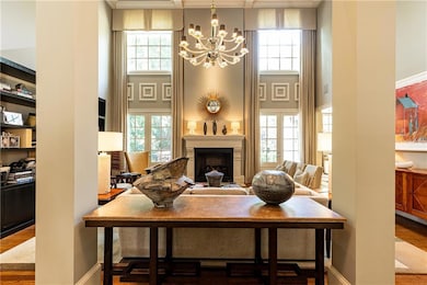 Dramatic and elegant entry into the vaulted living room.