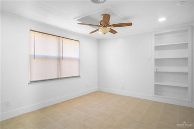 Empty room with ceiling fan, built in features, and recessed lighting