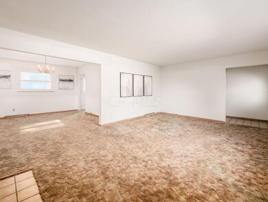 OPENS TO THE FORMAL DINING ROOM