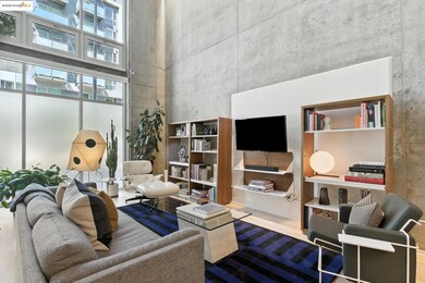 Living room with a high ceiling and wood finished floors