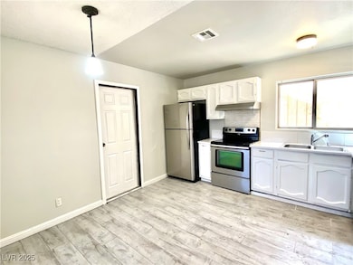 Kitchen with appliances with stainless steel finis