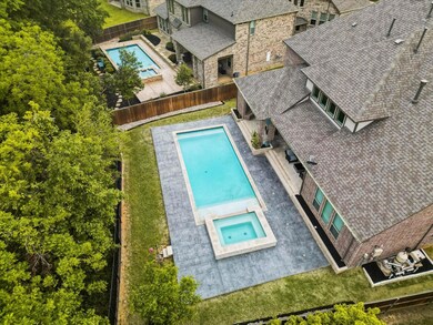 View of pool with an in ground hot tub and a patio area